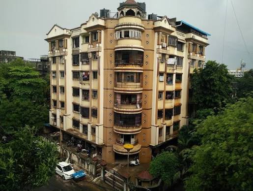 Maharashtra Notifies New Co-operative Housing Society Rules: What Flat Owners Need to Know Residential cooperative housing society buildings in Maharashtra following the newly notified cooperative housing society rules and governance reforms.